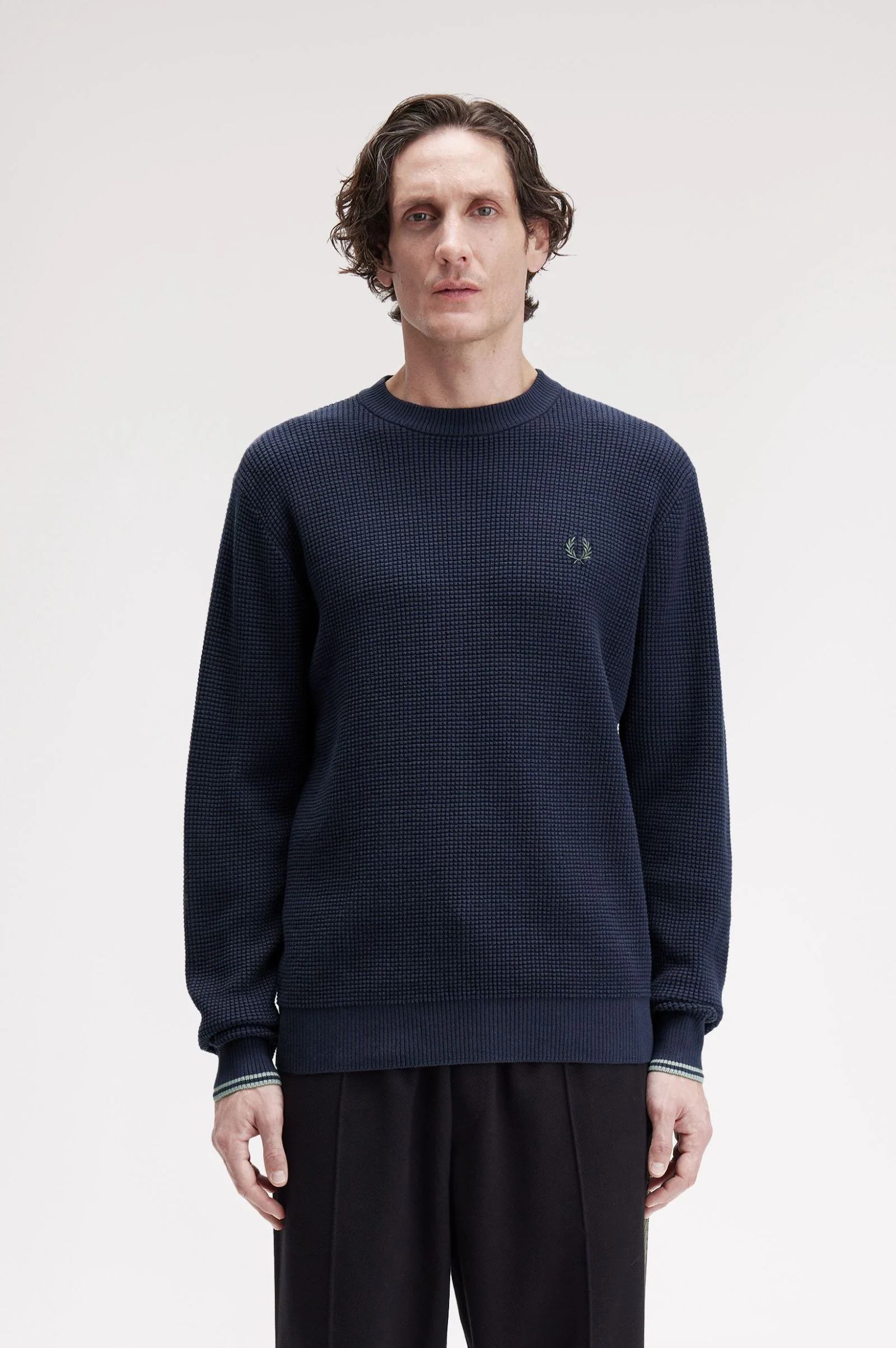 Pulls navy Fred Perry
